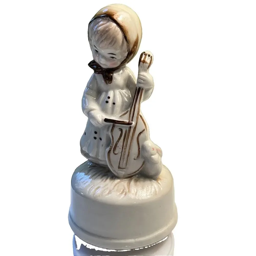Vintage bisque girl playing cello W/ Bunny music box 1983 tune “feelings” W/BOX